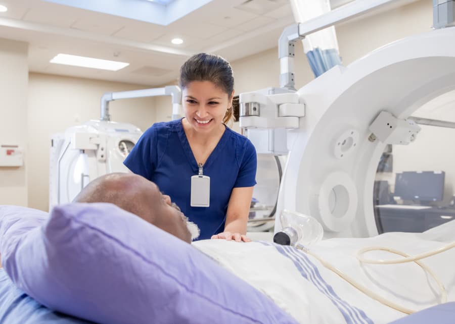 Radiology Nurse Reassuring Patient Prior to MRI